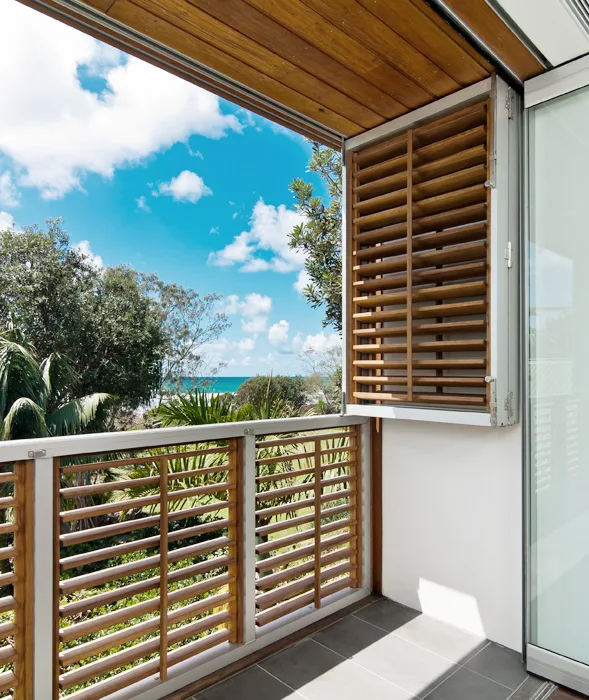 Timber-screened balcony overlooking the hinterland